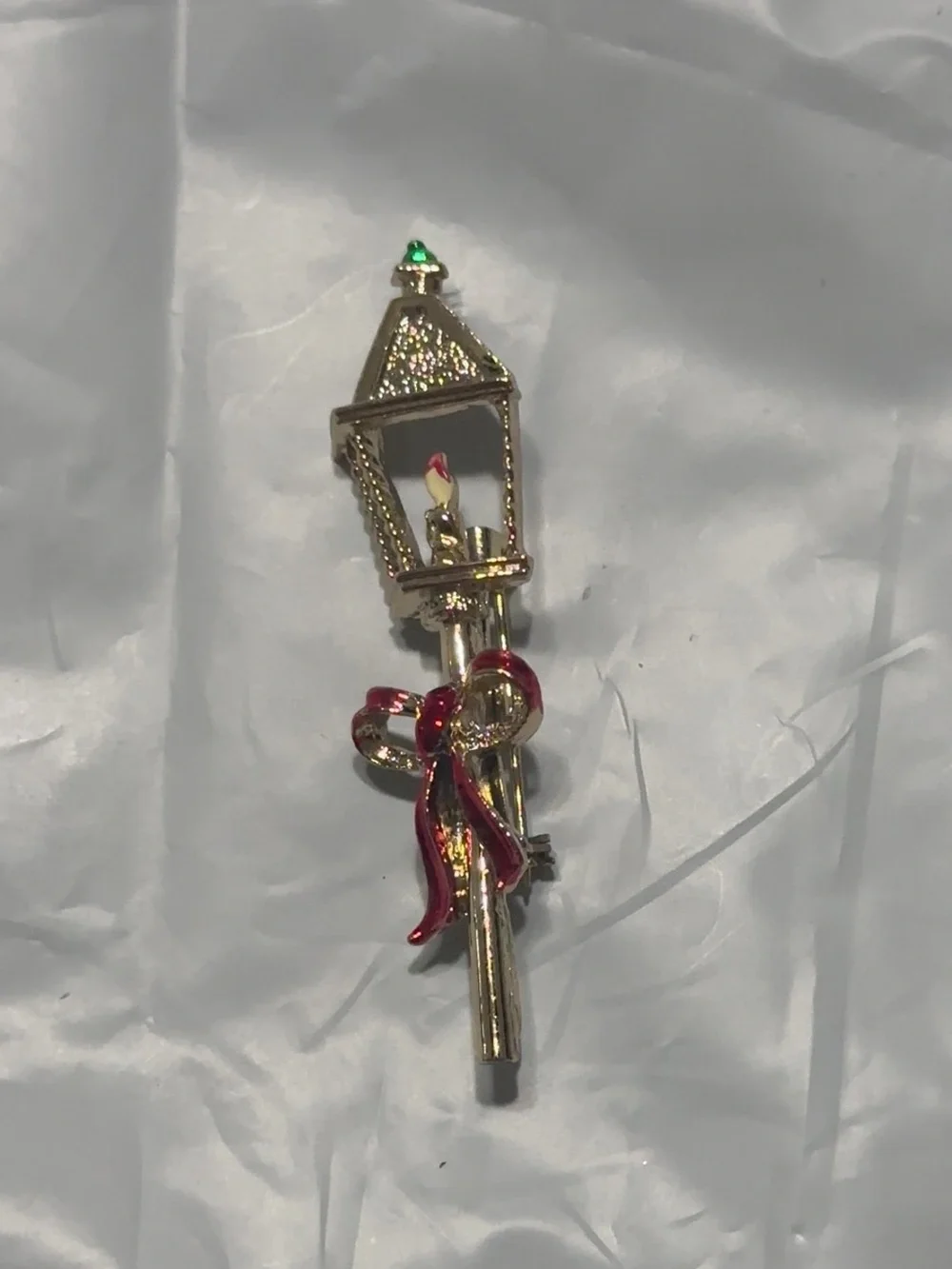 Gold Lamp Post Brooch with Red Ribbon and Emerald Accent